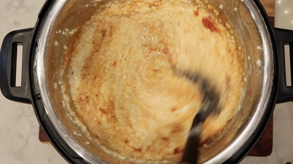 Stirring the pastina with everything in it